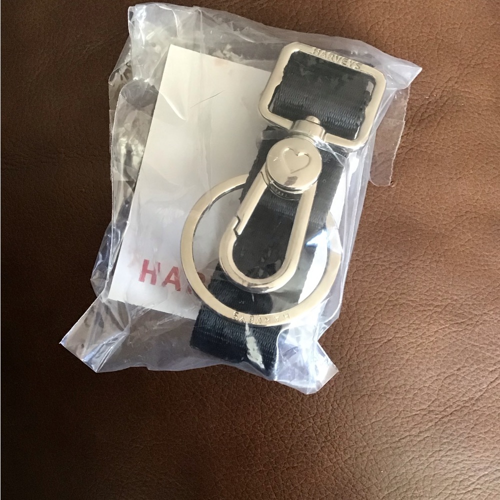 Brand new in plastic Harvey’s seatbelt purse key chain.